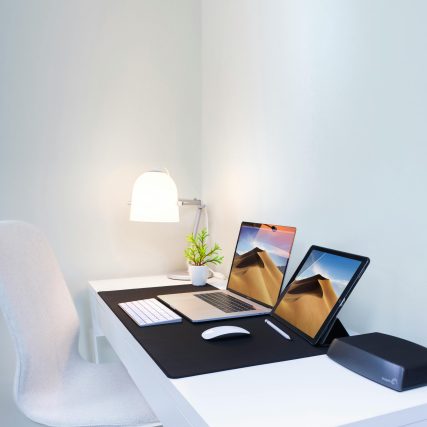 Stylish home office desk with dual screens and minimalist decor. Perfect for remote work and productivity.
